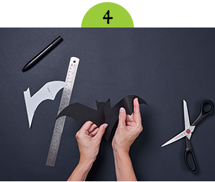 Folding black card to create bat