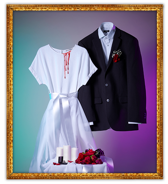 Gif of zombie bride and zombie groom Halloween costumes with blood dripping down the white dress and a table of LED candles and dying roses
